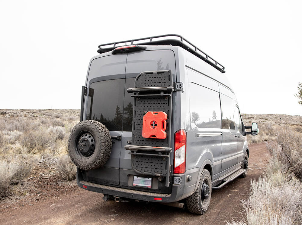 Ford Transit van with spare tire carrier, snowboard carrier, fuel can