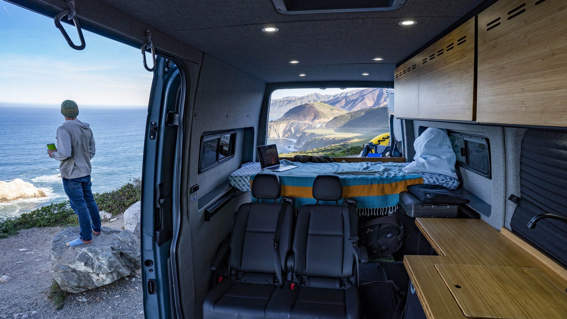 Man standing outside Sprinter Van