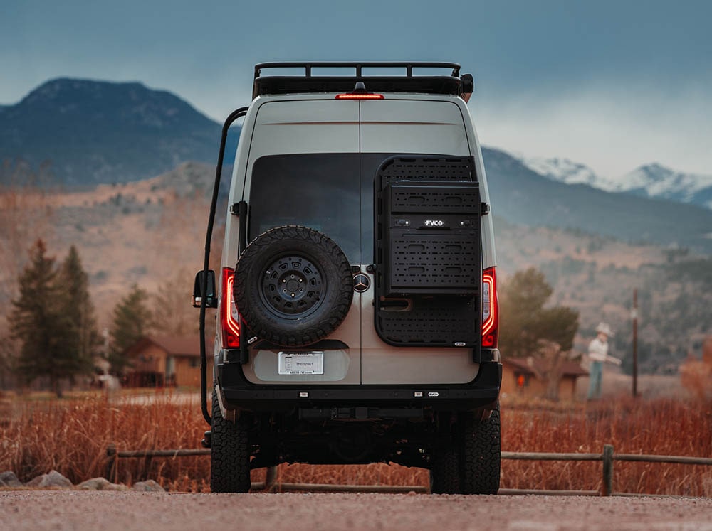 Mercedes Benz Sprinter camper van with FVC Rear Bumper, Rear Tire Carrier, and Rear Door Passenger Platform with Storage Box mounted