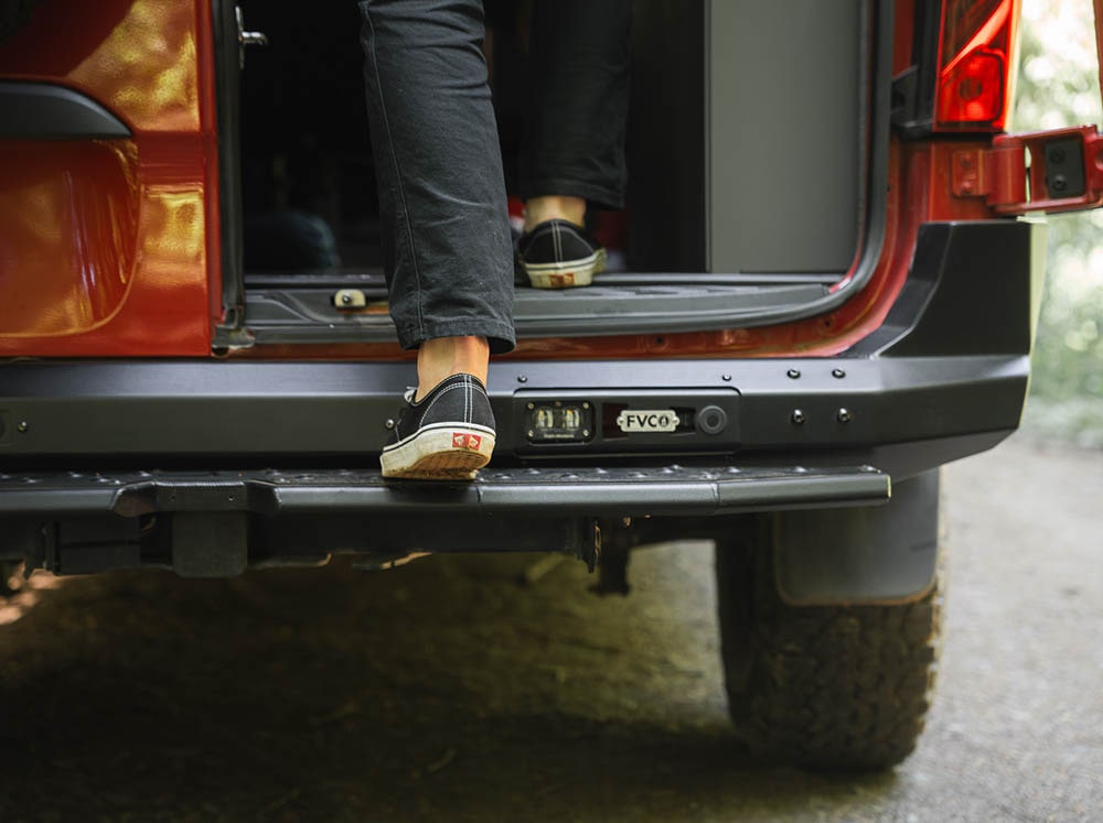 Person stepping into van on Sprinter Rear Plate Step
