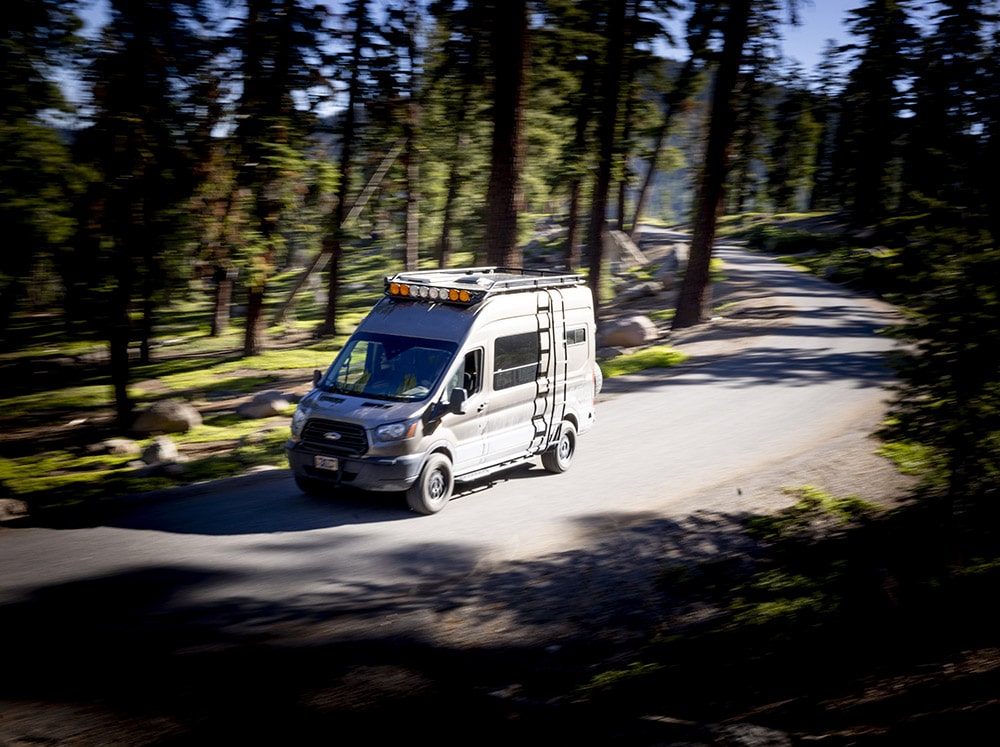 Ford Transit with Roof Rack on Road