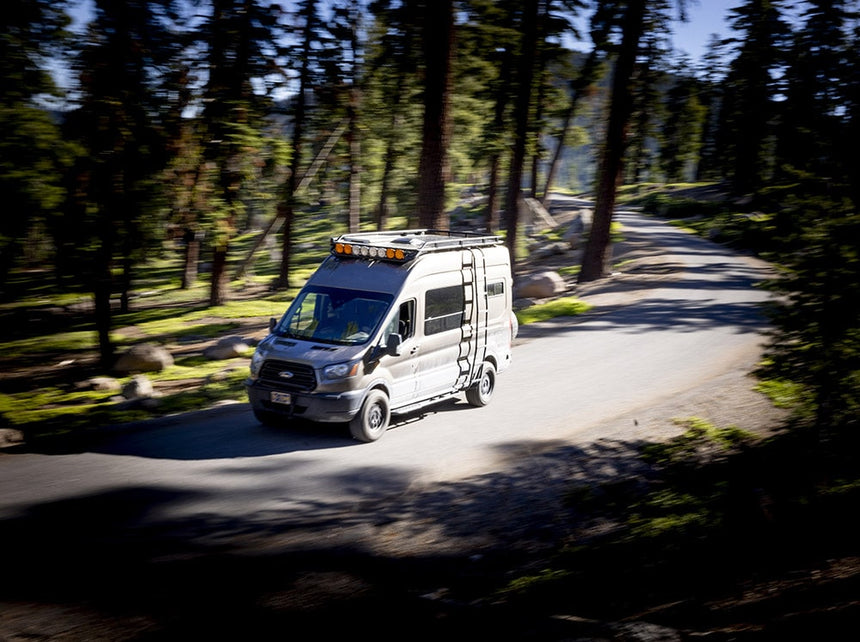 Ford Transit with Roof Rack on Road