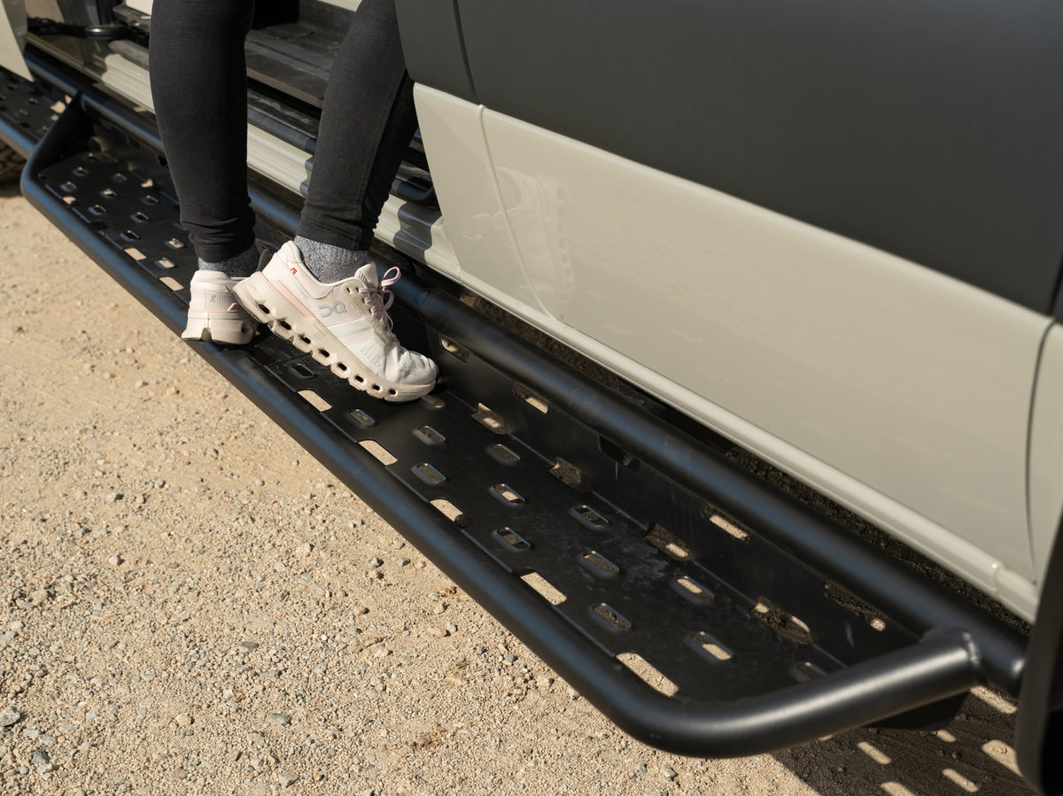 Person using Sprinter Aluminum Side Steps to access van