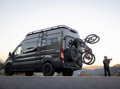 Fully loaded Transit adventure van on a biking trip with photographers