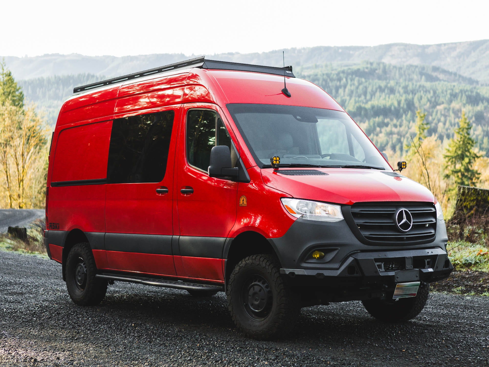 Sprinter 144 van with FVC front bumper, low pro roof rack with fairing, and sprinter side steps