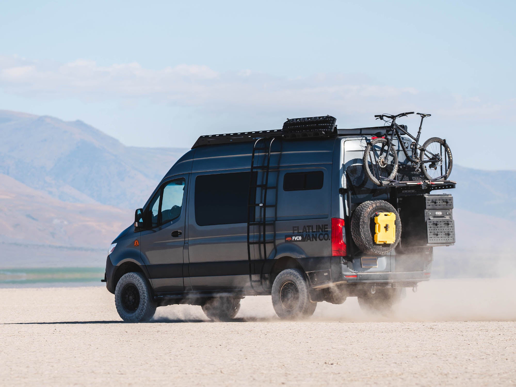 Mercedes Benz Sprinter van with Standard Roof Rack installed, driving in the desert