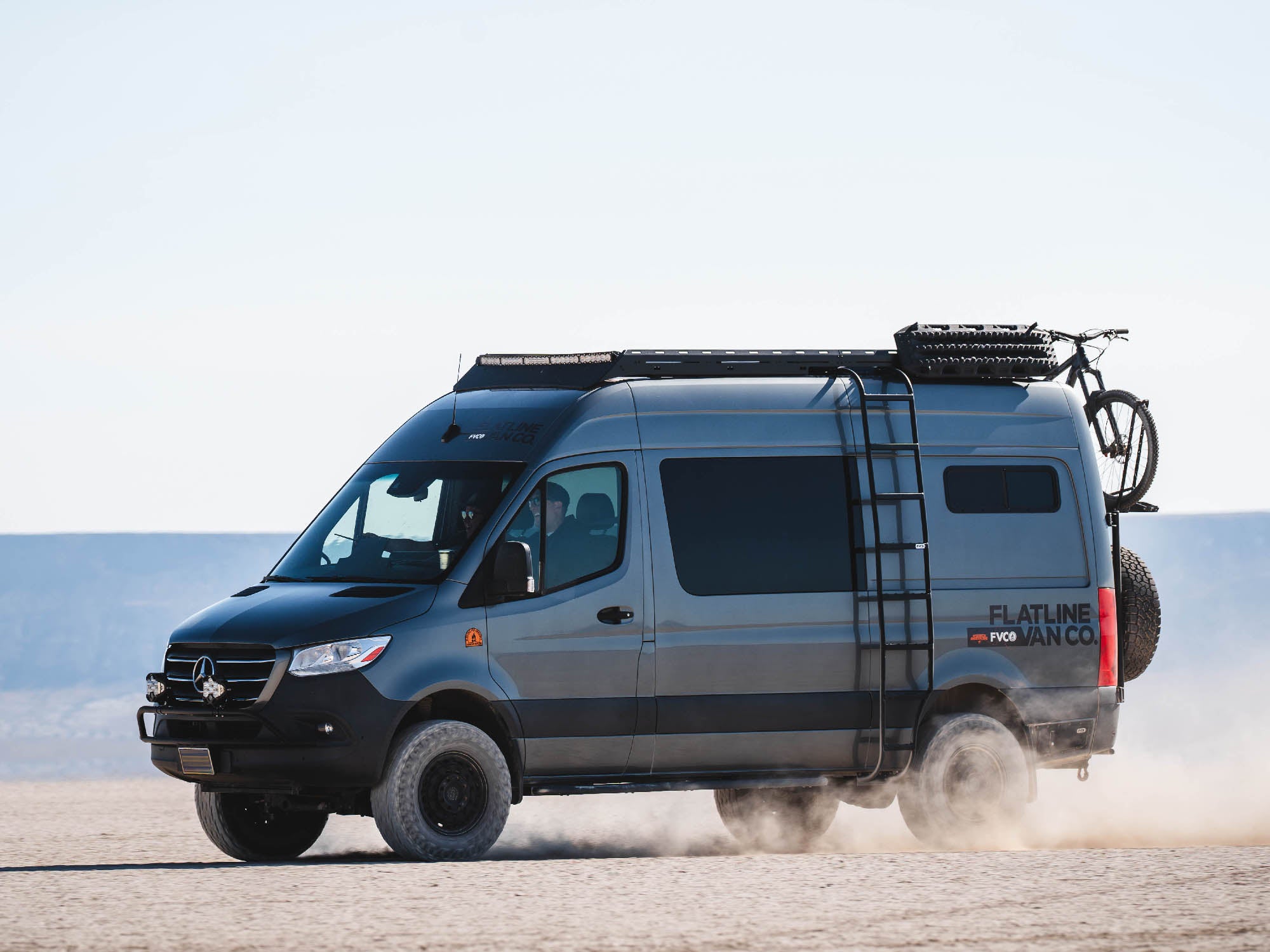 Sprinter van with FVC Standard Roof Rack and wheel wrap side ladder