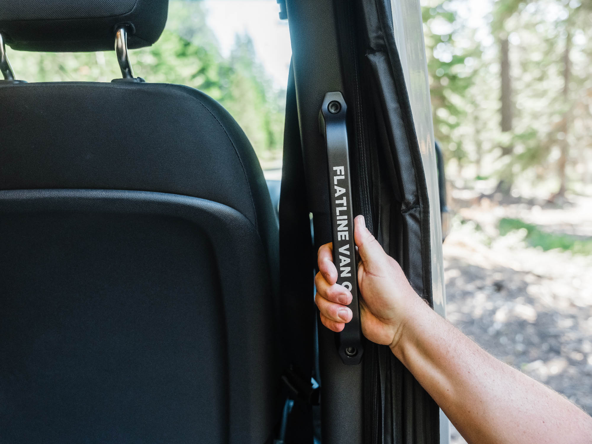 Person using the Sprinter Van Slider Door Grab Handle at ideal height for all