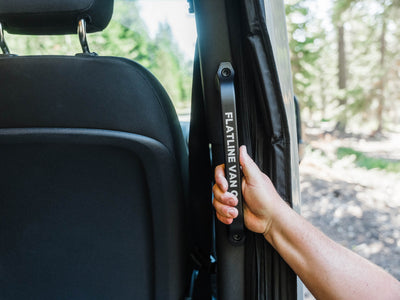 Person using the Sprinter Van Slider Door Grab Handle at ideal height for all