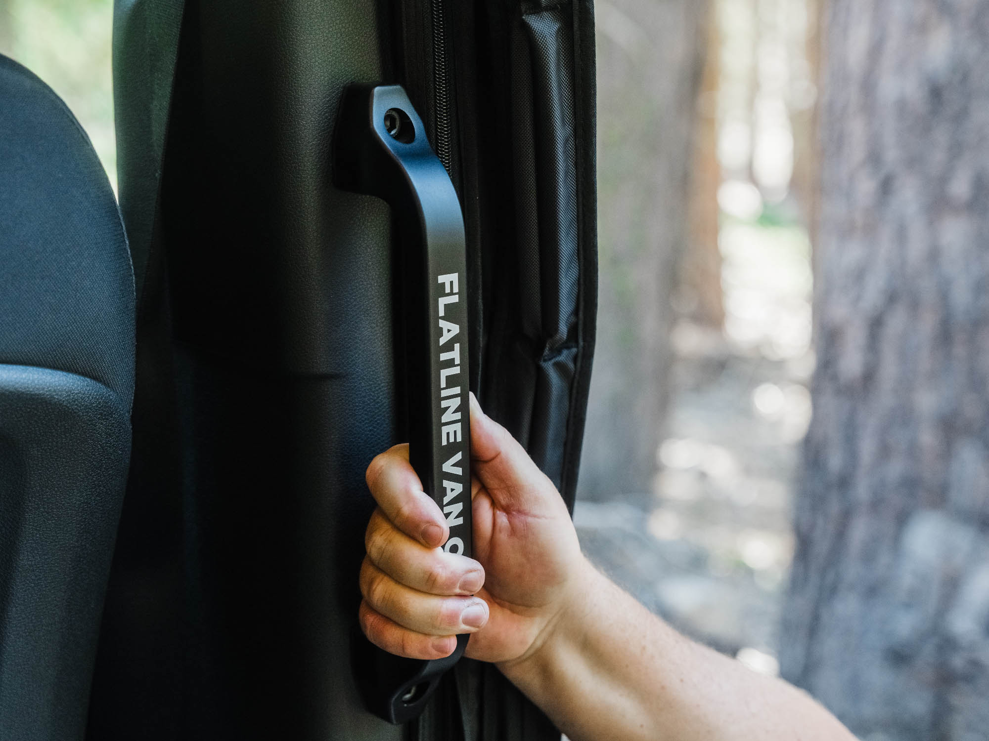 Person using Sprinter Slider Door Grab Handle to easily step into van