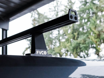 View of Standard 71" wide crossbars with Sprinter Crossbar Roof Rack towers on a high roof Sprinter van