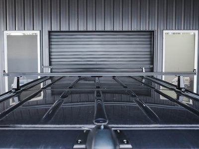 View of installed Sprinter Crossbar Roof Rack on a high roof van with the Standard 59.75" crossbar option