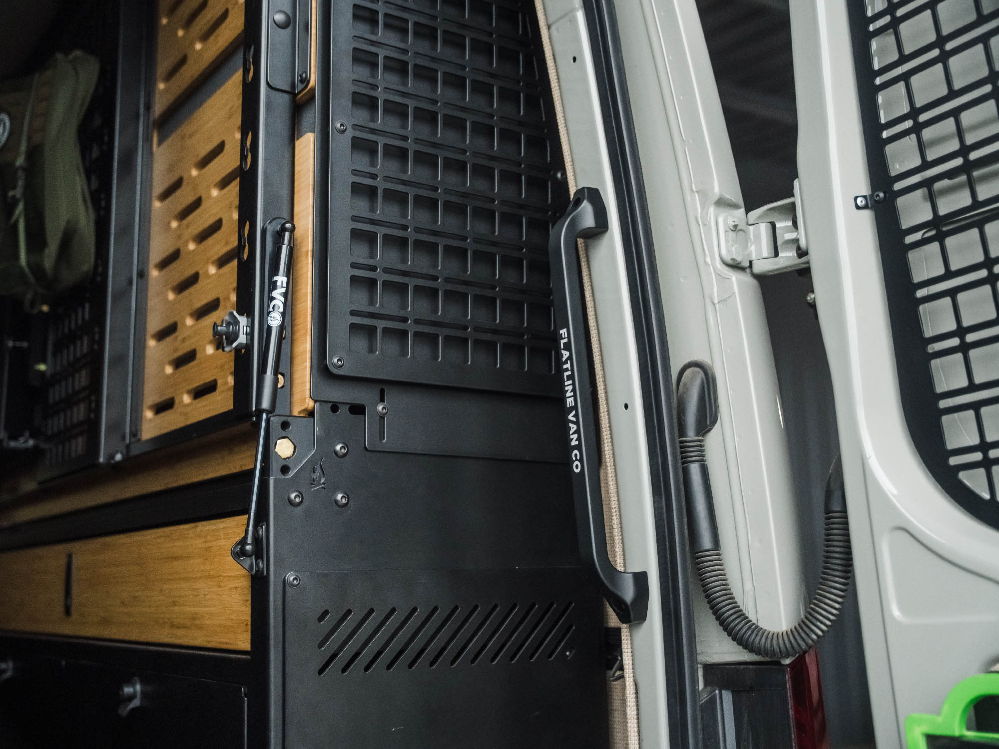 Sprinter Van Rear Door Grab Handle installed in adventure van with Murphy Bed