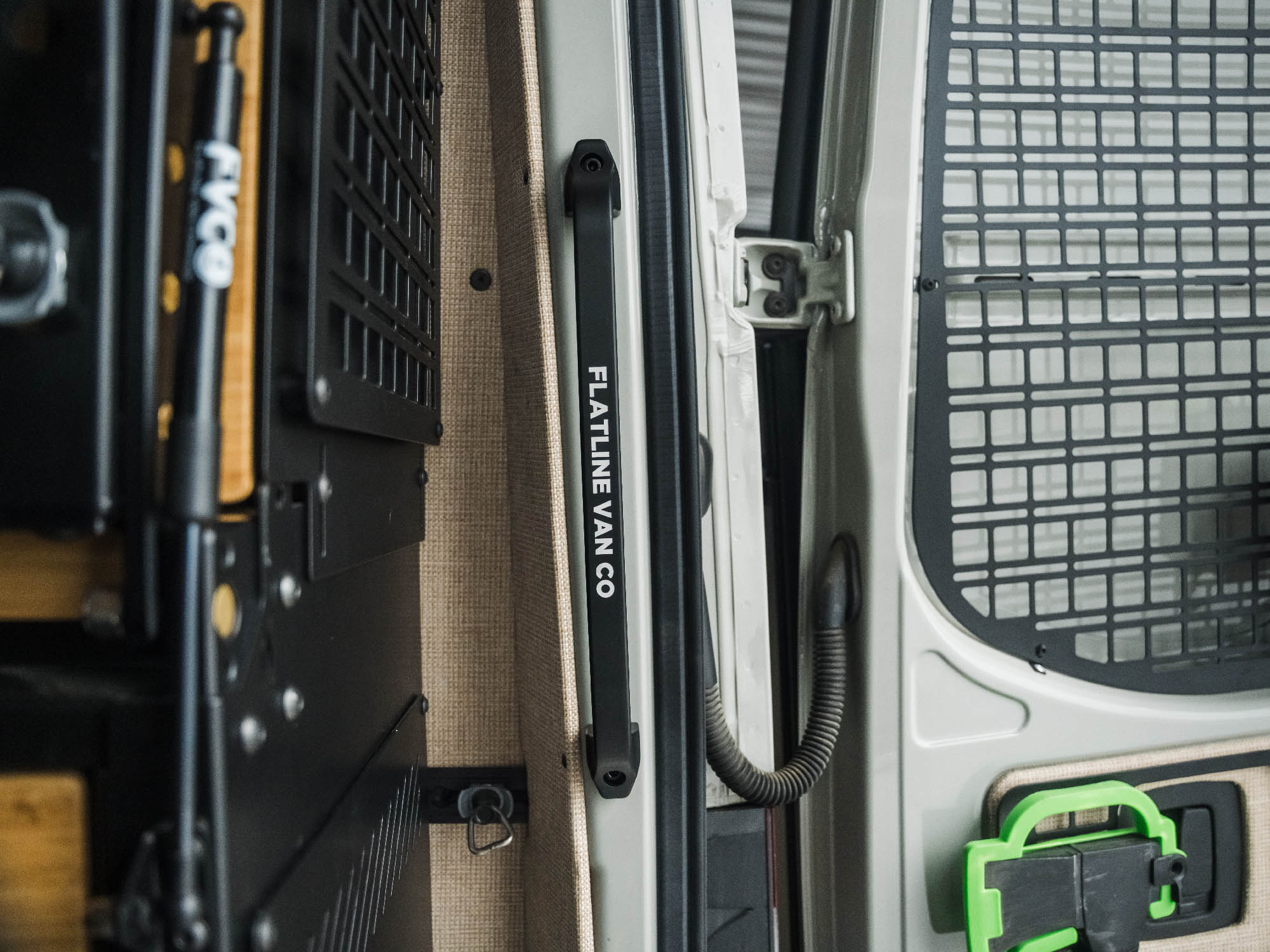 Straight-on view of Sprinter Rear Door Grab Handle showing that it does not extend into van past the metal of rear doors