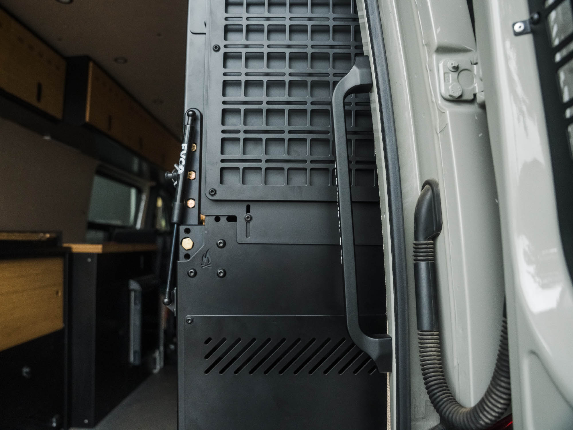 Showing Sprinter Rear Door Grab Handle installed in outfitted camper van