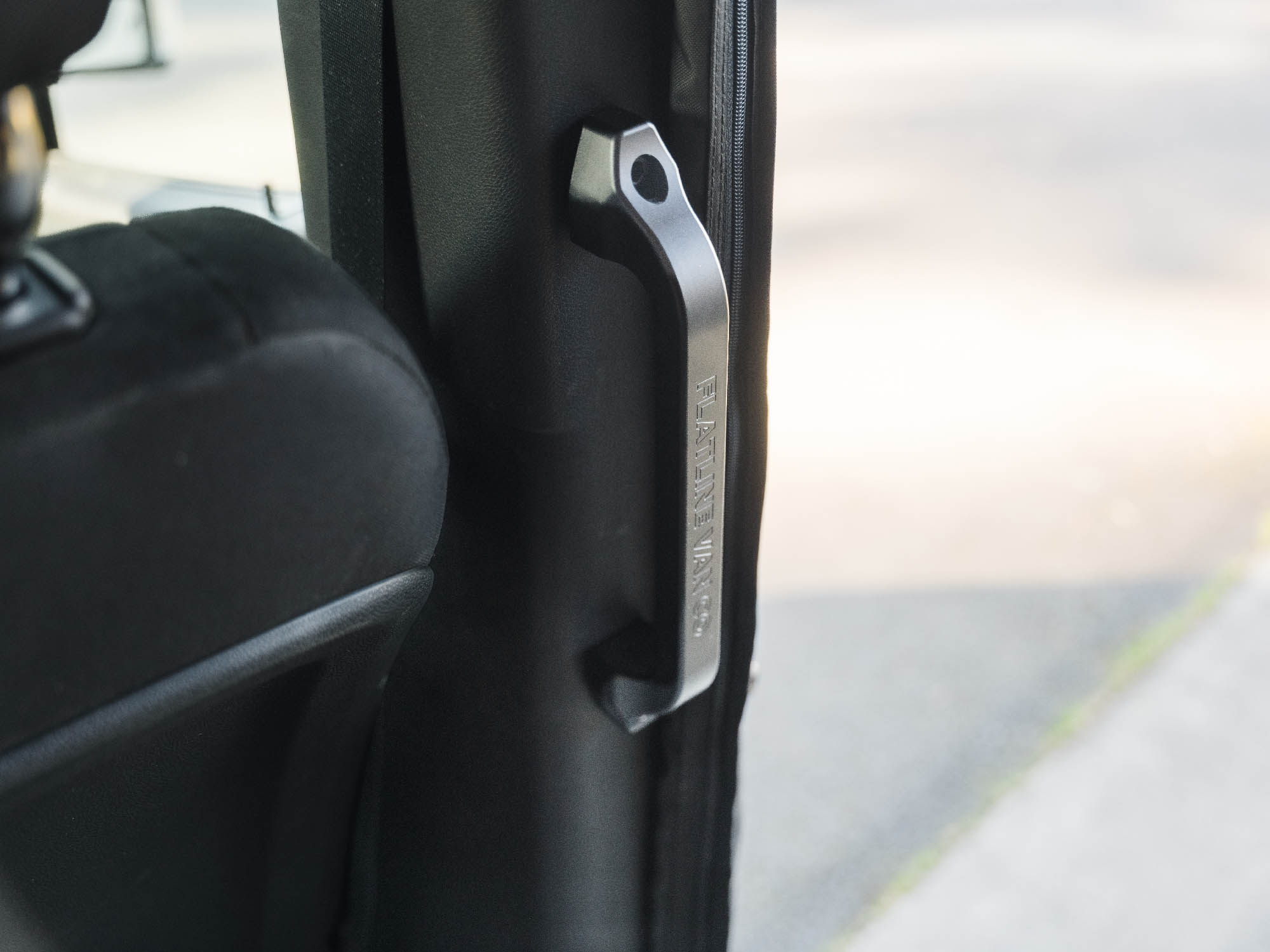 Sprinter Slider Grab Handle with black logo installed in adventure van