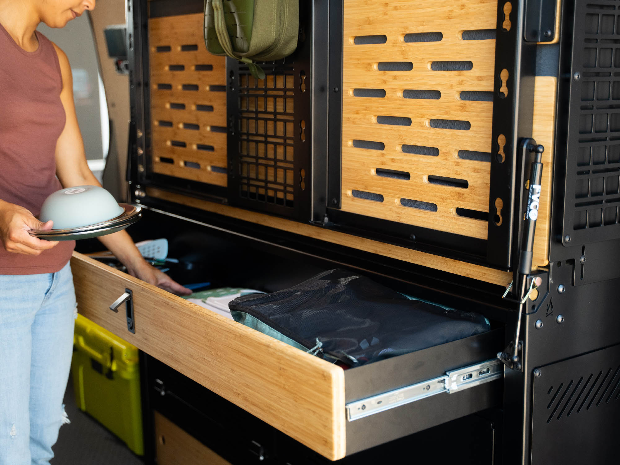Storing camp kitchen items in the Sprinter Murphy Bed System