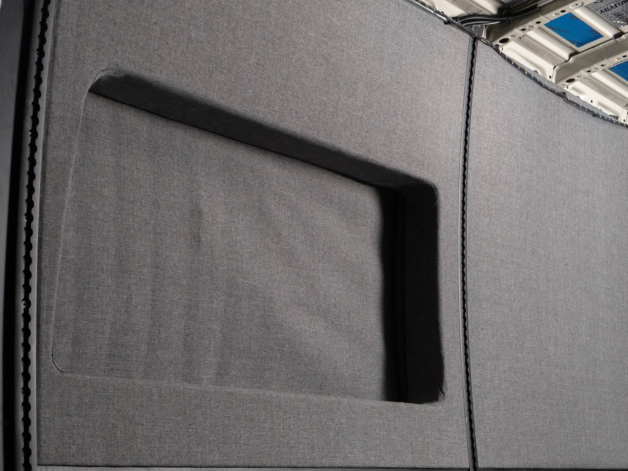 Front and rear pieces of Sprinter Flush Mount L-Track Kit for 144 installed in camper van