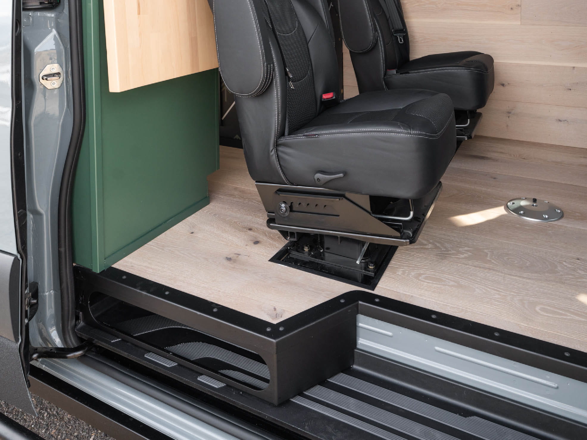 Sprinter Step Extension adds more flooring in professional Sprinter van build by Activan