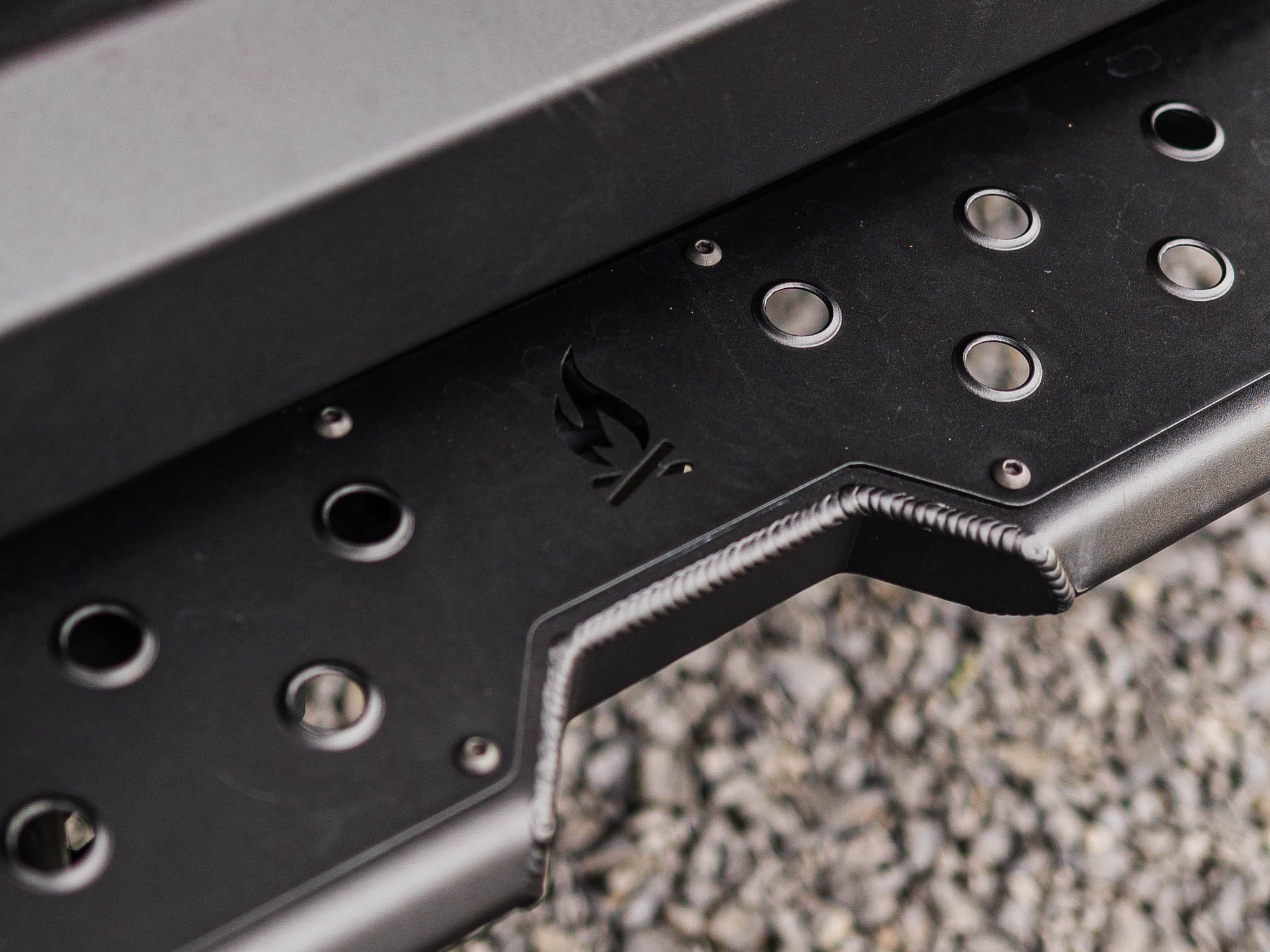 Close up view showing traction details and FVC logo of installed Sprinter Rear Plate Step