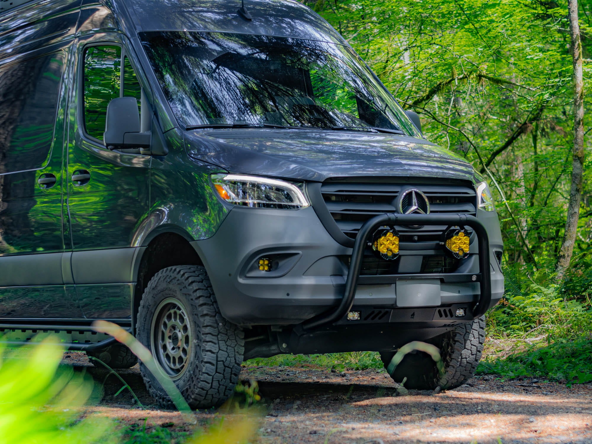 Sprinter Van Bull Bar installed on van driving in the woods 
