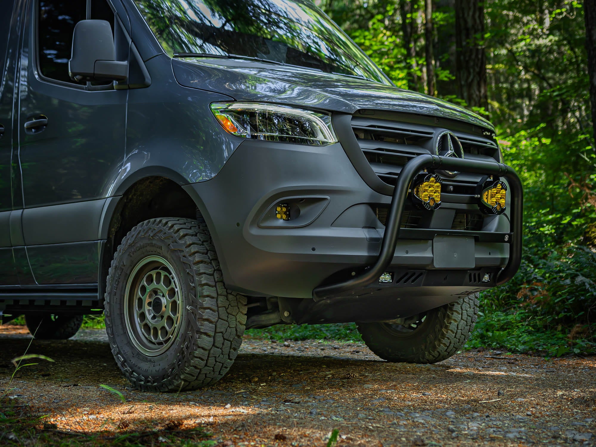 Sprinter Skid Plate installed with Sprinter Bull Bar on van camping in the woods