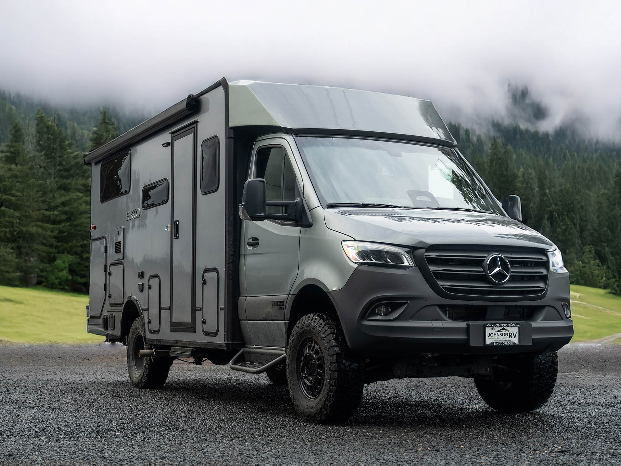 Winnebago Ekko Sprinter Side Steps installed on van in the woods