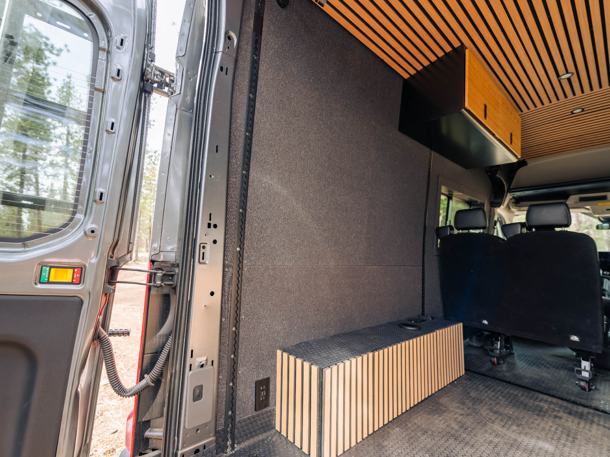 View showing both driver-side pieces of the Transit Bed Bracket Flush Mount L-Track installed in 148" High Roof