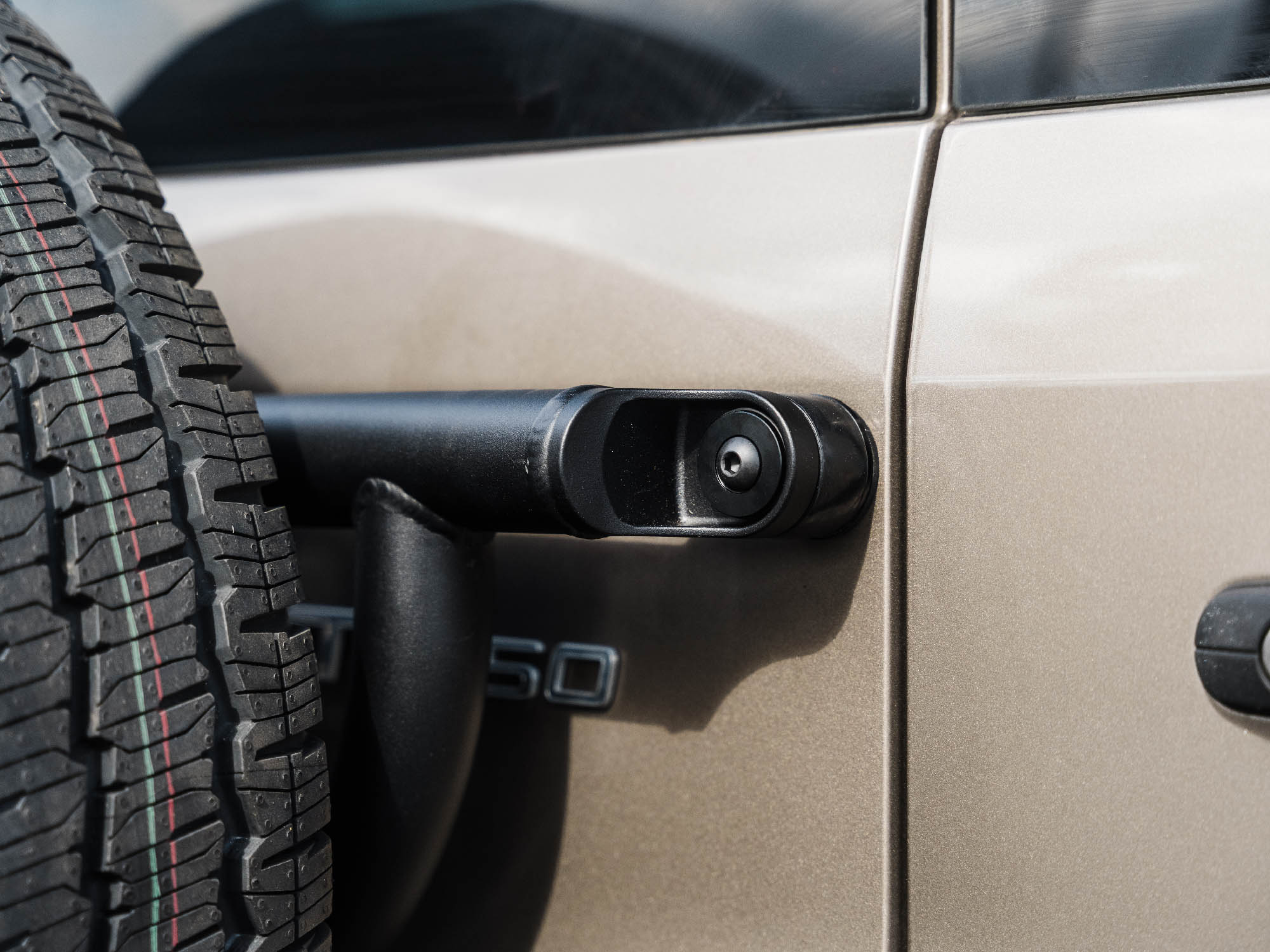 Detail view of Transit Tire Carrier mounting point on door of Transit van