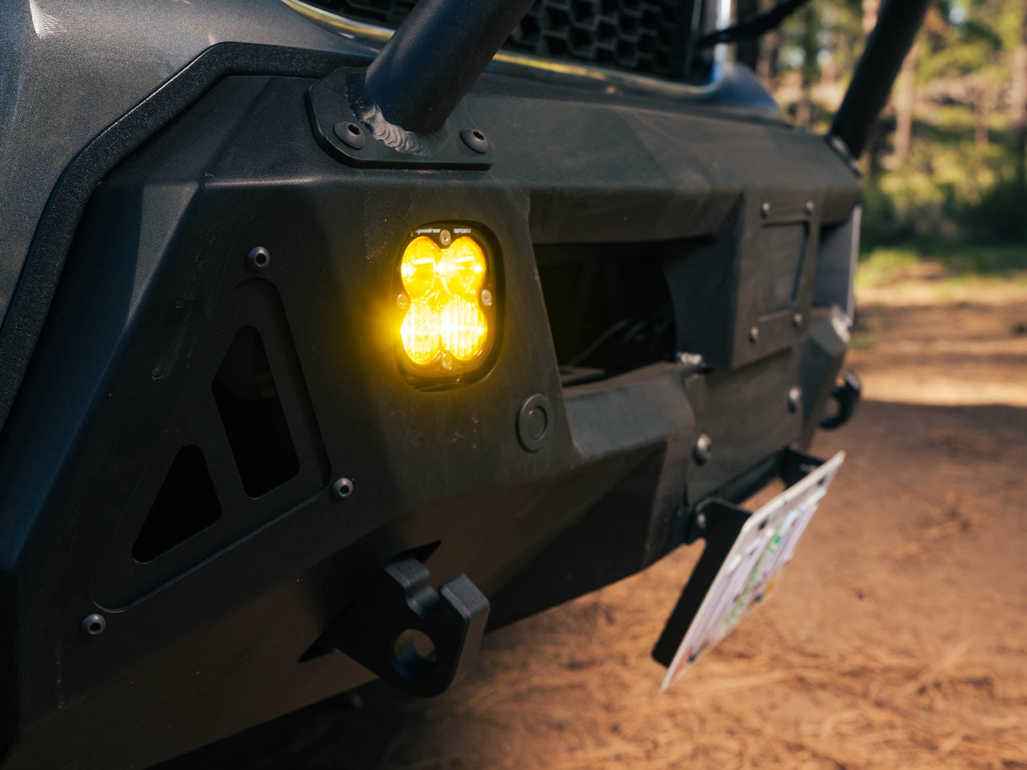 Detail view showing Ford Transit Core Front Bumper pod lights and tow hooks