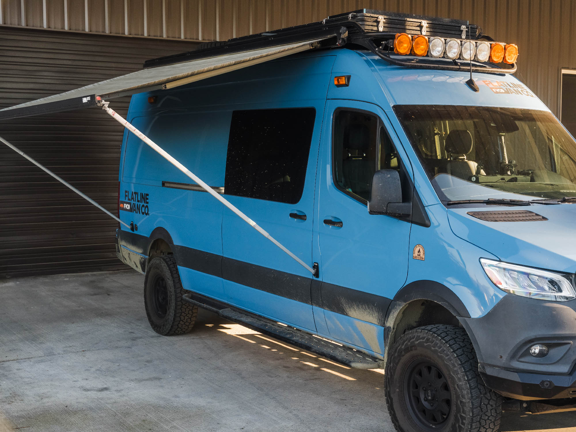 Fiamma awning leg bracket pads installed on adventure van