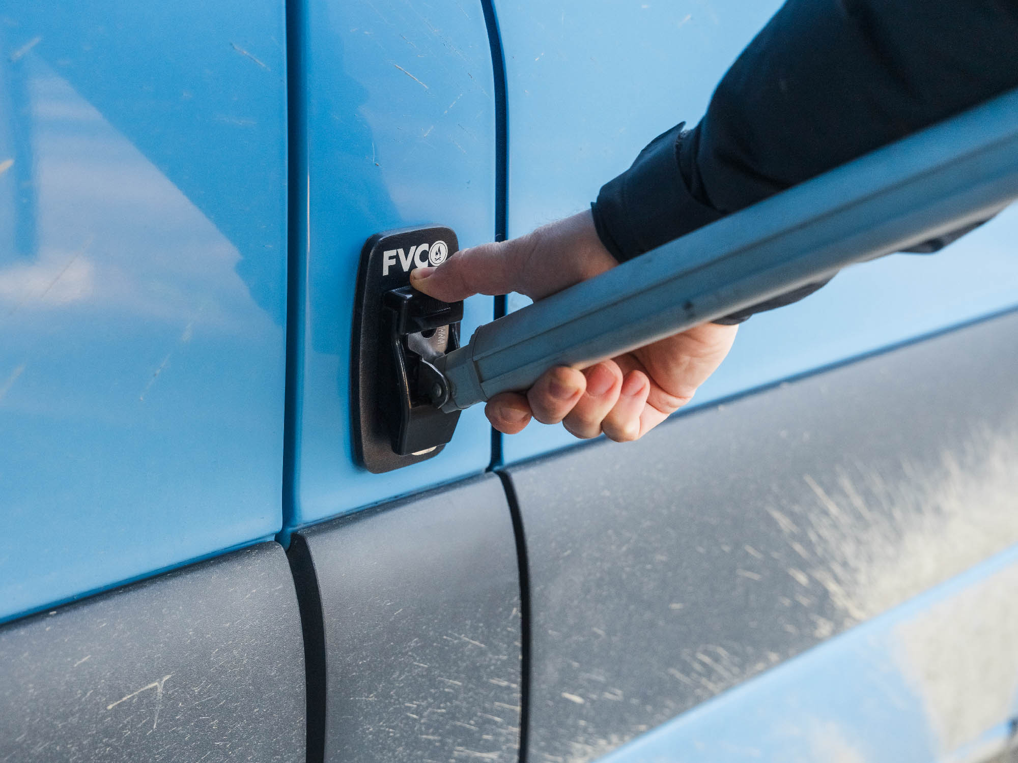 Person removing leg from Fiamma awning leg bracket pad