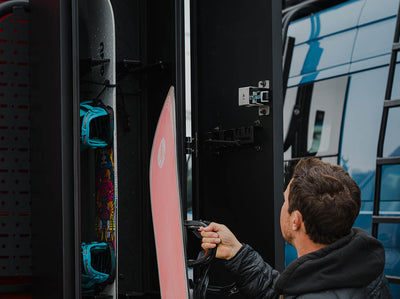 Aaron Blatt loading snowboards in Adventure Van Ski & Snowboard Locker