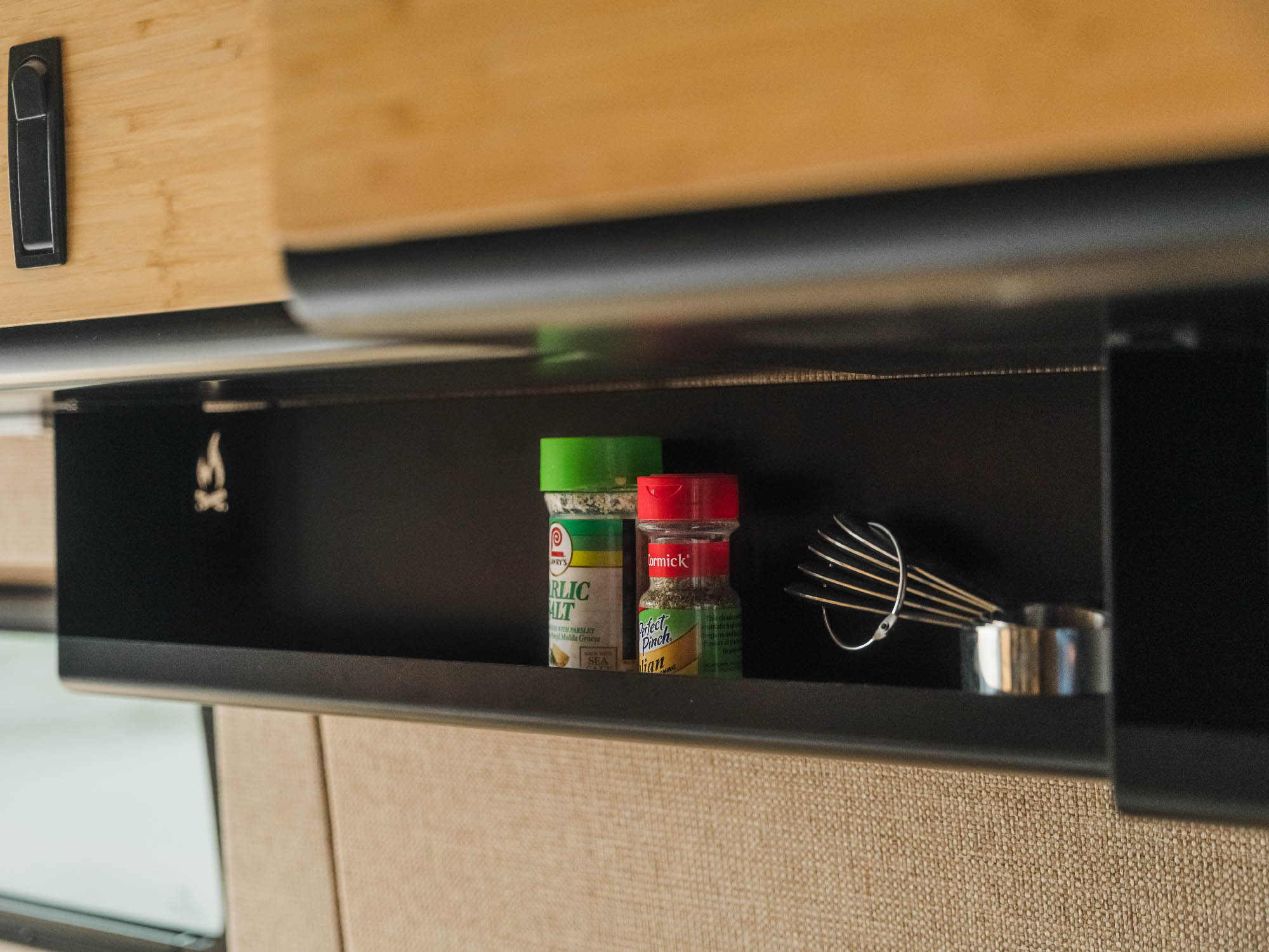 Shallow under cabinet shelf with universal fitment as a spice rack