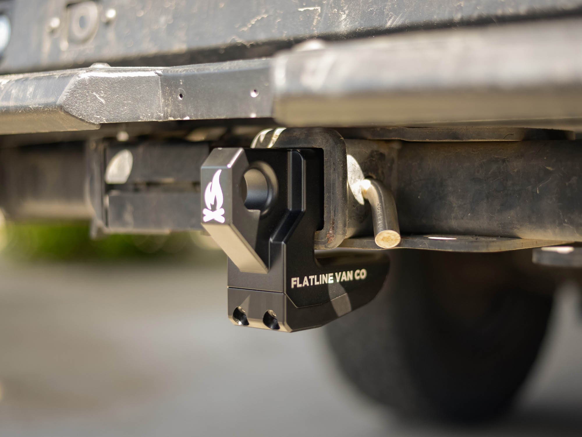 Close up view of Hitch Slider by Flatline Van Co, pictured with Delrin skid pad