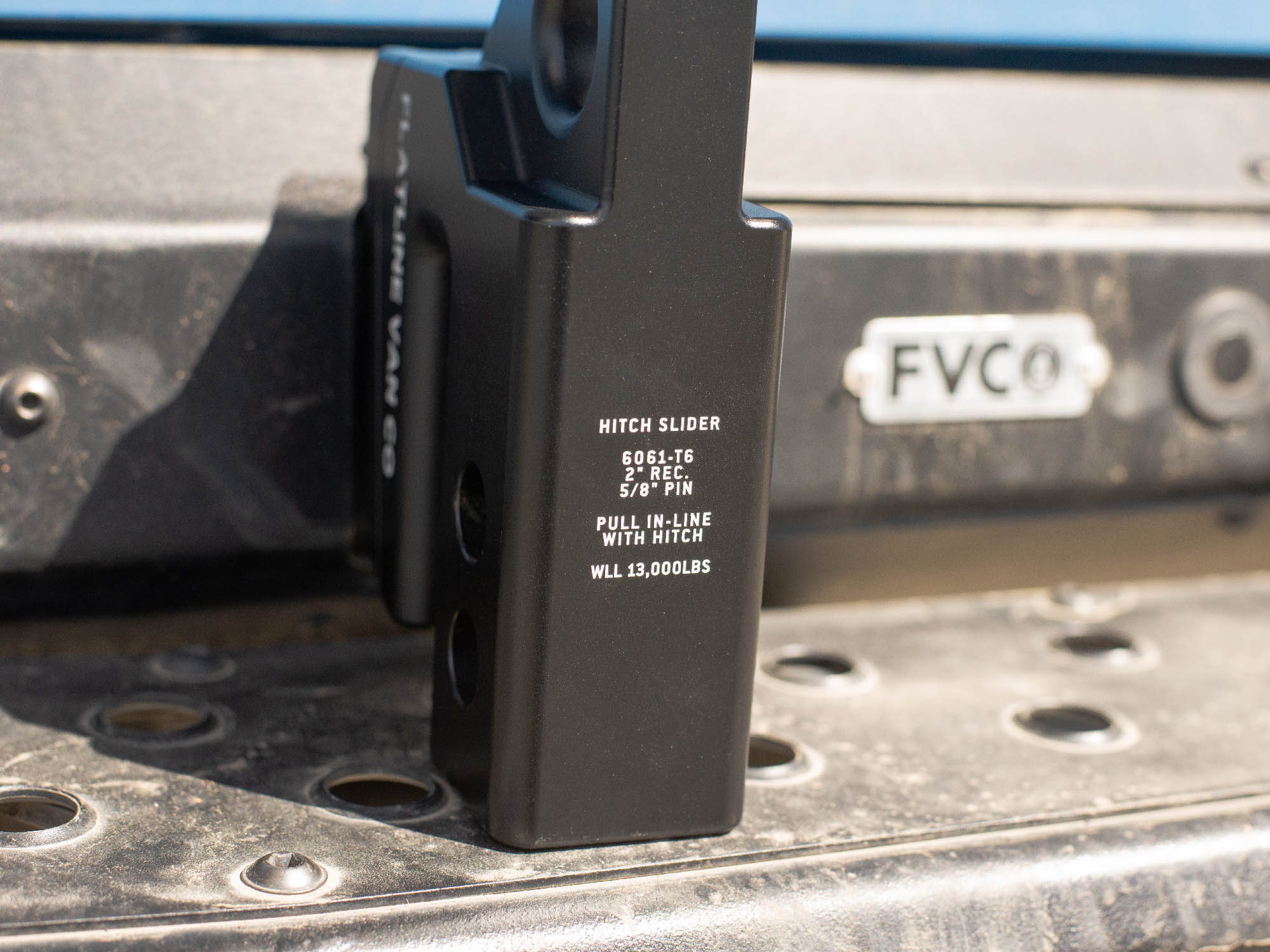 Detail image of top side of Hitch Slider showing specs for 2" receiver, 5/8" pin, 13,000lbs limit