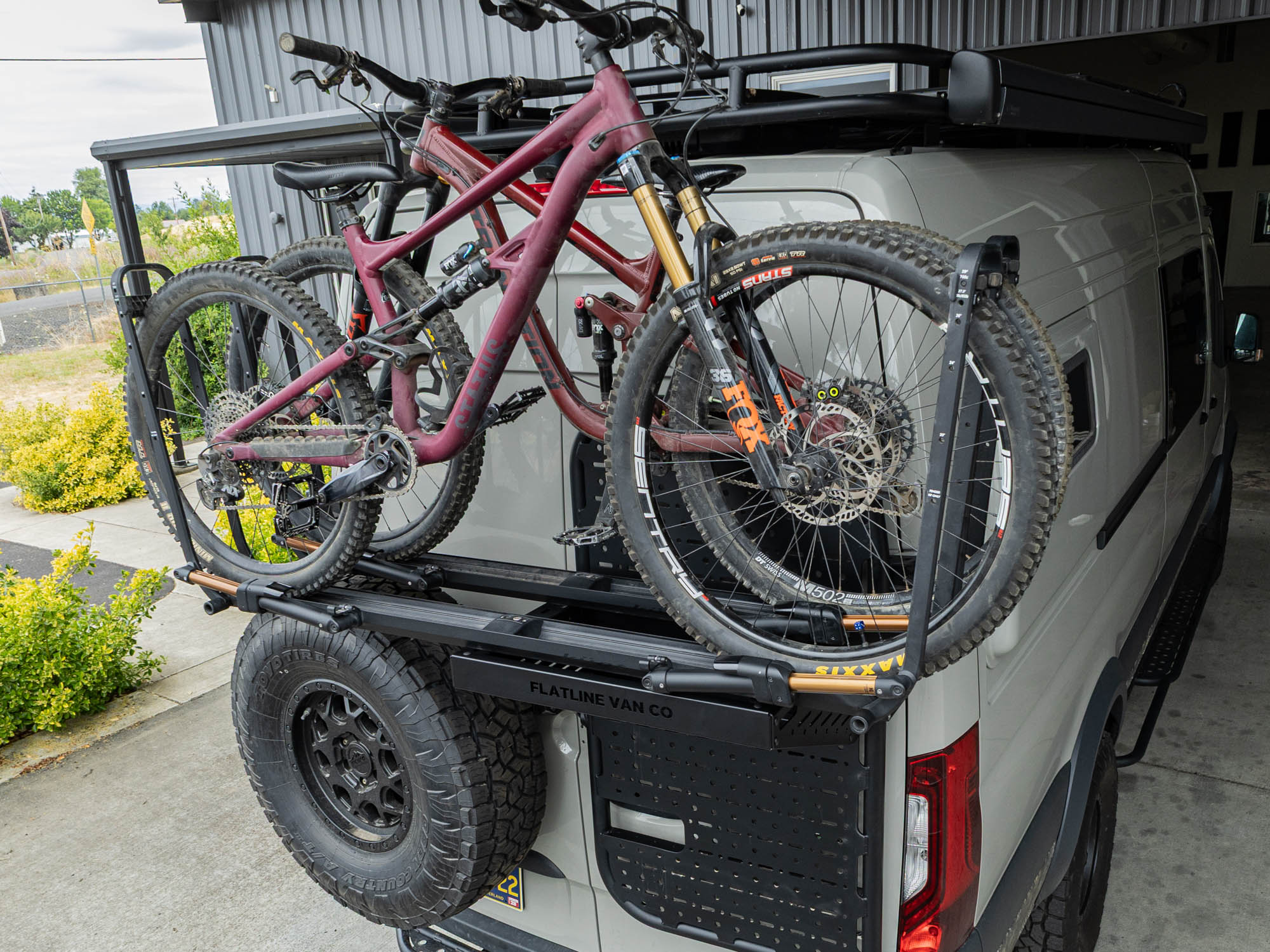 Sprinter van carrying two mountain bikes on the Rear Door Platform Bike Rack Adapter with Kuat Piston SR Bike Racks