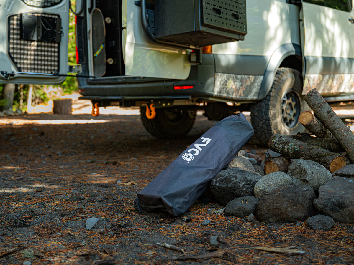 FVC Camp Chair waiting to be secured to storage panel attached to Sprinter rear door molle panel