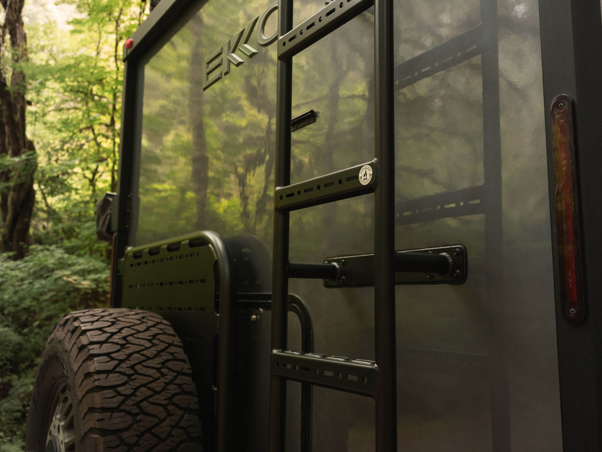 Close up view of installed Winnebago Ekko Rear Ladder with factory holes sealed 