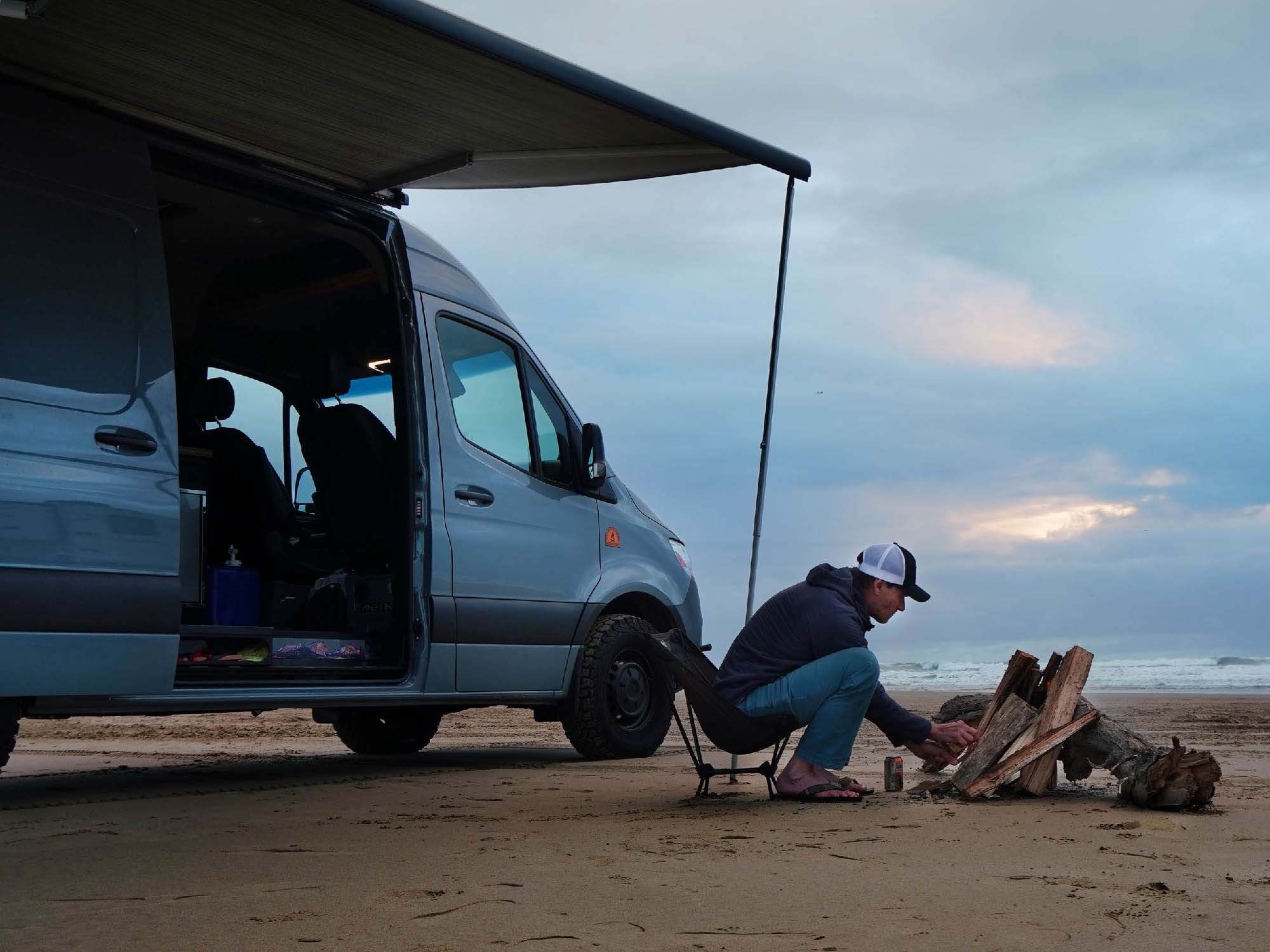 Fiamma F80s awning setup on a Sprinter van on the beach