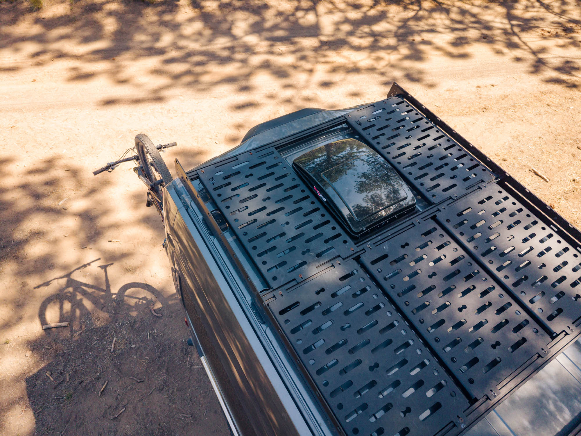 Rooftop decking panels for camper vans installed on Flatline Van Co Transit Low Pro Roof Rack