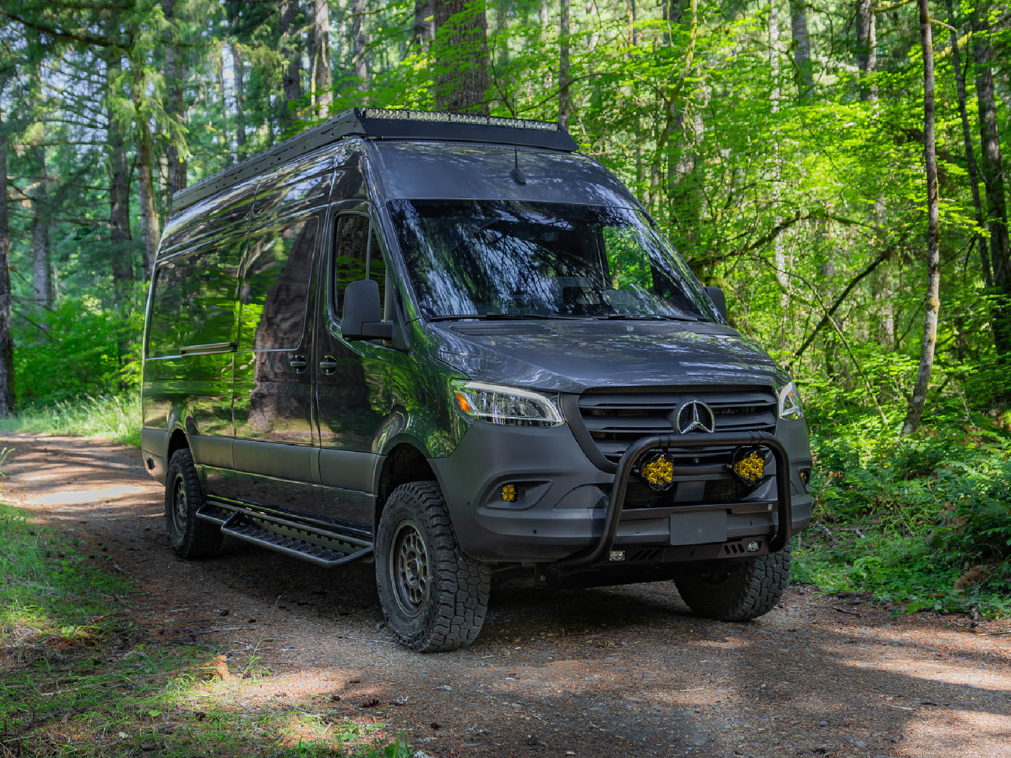 Dark grey Sprinter camper van with Sprinter Van Bull Bar installed with off road lighting