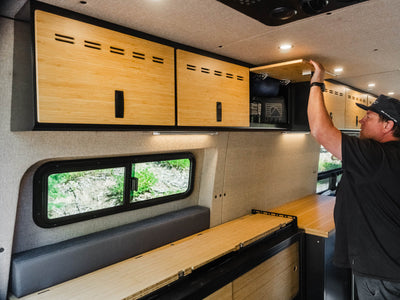 Person opening door of Sprinter Van 40" Shallow Upper Cabinet