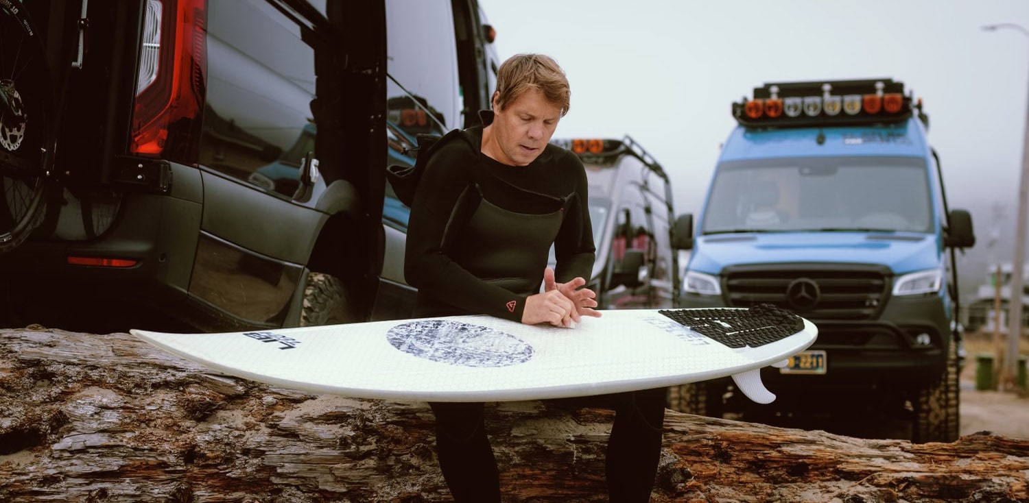 Travis Rice with Lib Tech Surfboard