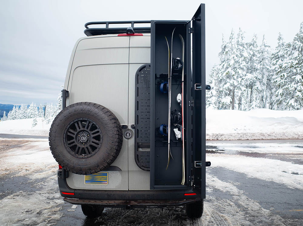 Ski and Snowboard Locker with one set of skis and two snowboards loaded and secured with included straps