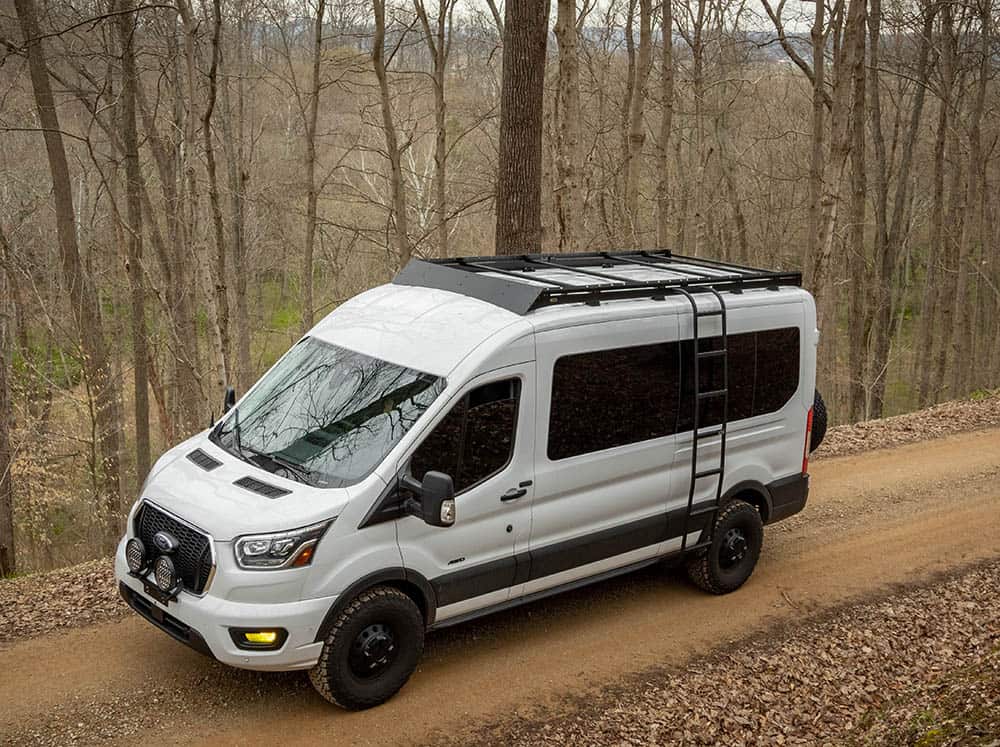 High-front angle view of Transit Mid Roof Low Pro Roof Rack Installed on white Transit van