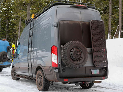 Transit van with rear tire carrier, rear door platform, safari rack, and ladder